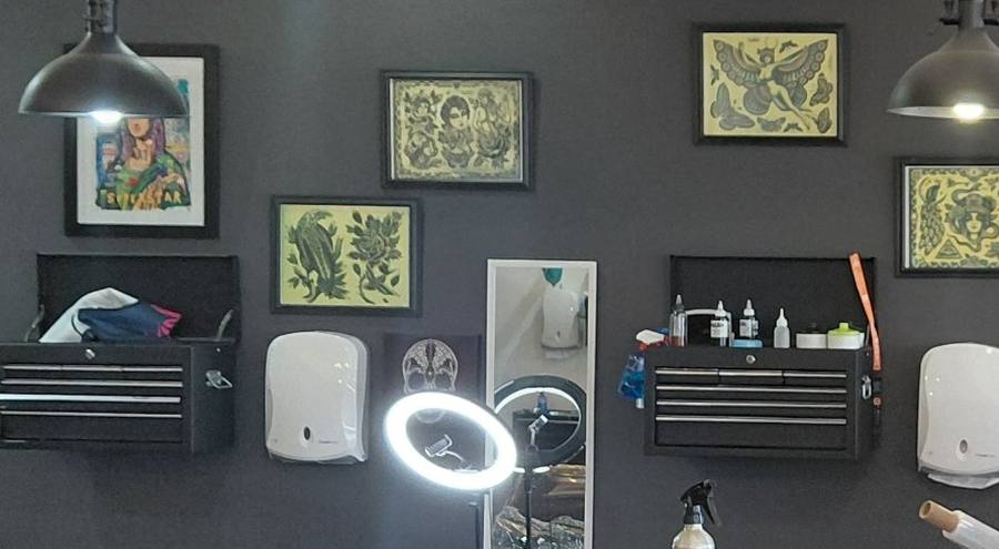 Wall of framed traditional flash above the tool stations